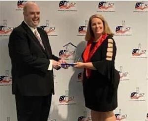 Chef Bedford receiving award from ACF representative.